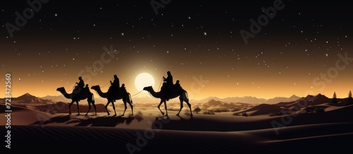 Camel caravan in the Sahara desert at night. 