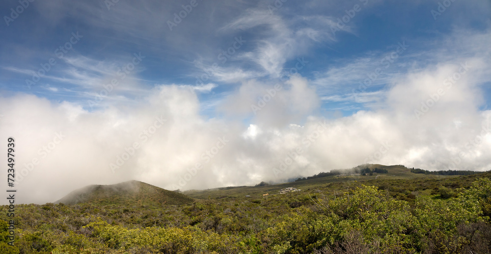 Standing on the higher ground above the clouds concept, panoramic view from the Top of Haleakala volcano with beautiful mountain valley on Maui Hawaii 