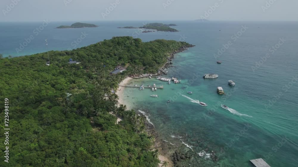 Aerial view of a tropical beach with docked boats and lush greenery, perfect for travel and vacation-themed designs, Phu Quoc, Vietnam Aerial view of a tropical beach with docked boats and lush greenery, perfect for travel and vacation-themed designs, Phu Quoc, Vietnam