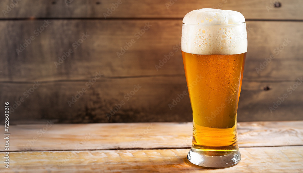 Glass beer on wood background with copy space