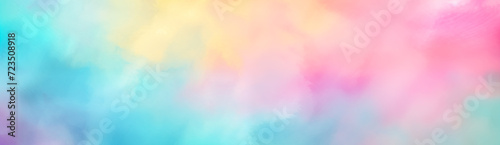 Colorful pastel background. Abstract watercolor sunset sky with fluffy clouds in bright pink, green, blue, yellow, and purple rainbow colors. Wide banner with copy space for text. 