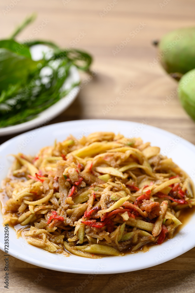 Thai food, Spicy mango salad with dry shrimp eating with fresh vegetables Thai food, Spicy mango salad with dry shrimp eating with fresh vegetables
