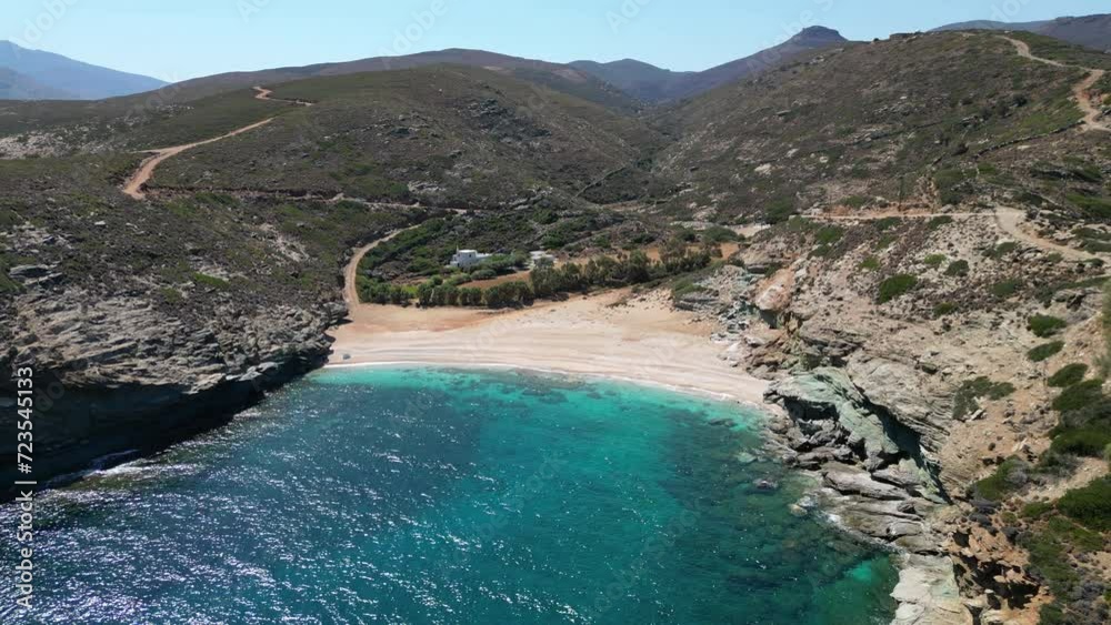 Aerial drone video of iconic turquoise and sapphire bay and beach of Andros, Cyclades, Greece Aerial drone video of iconic turquoise and sapphire bay and beach of Andros, Cyclades, Greece