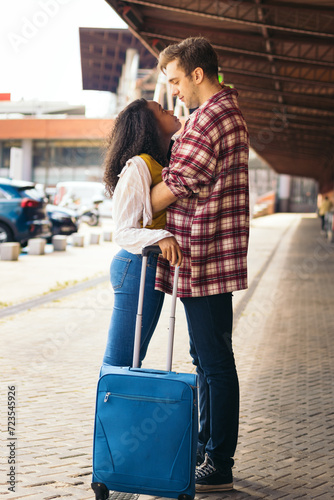Konstfotografi Reunited at last!: Young couple meeting at the station after a trip