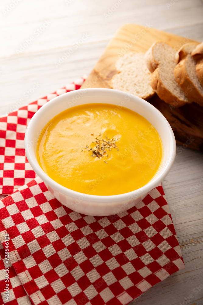 Homemade carrot and pumpkin cream soup. Easy, nutritious and healthy recipe. Served in a white bowl with bread croutons. Perfect to accompany everyday food. Homemade carrot and pumpkin cream soup. Easy, nutritious and healthy recipe. Served in a white bowl with bread croutons. Perfect to accompany everyday food.