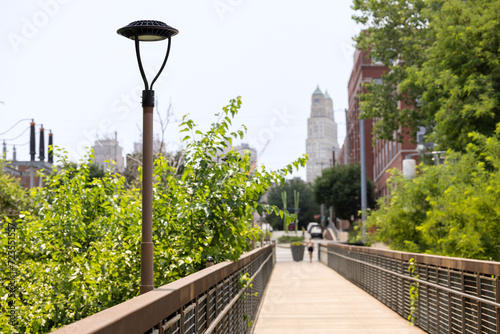 Afternoon view of the River Market Bridge and the downtown skyline of Kansas City, Missouri, USA. photo