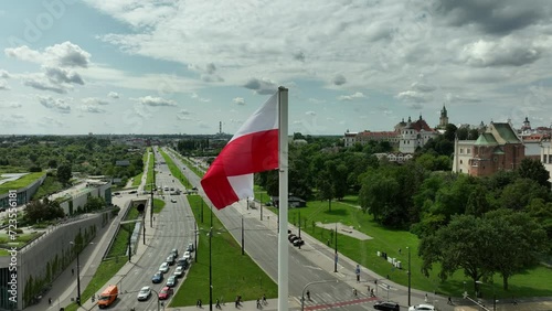 Polish Flag Over Urban Landscape: A Symbol of Pride and History