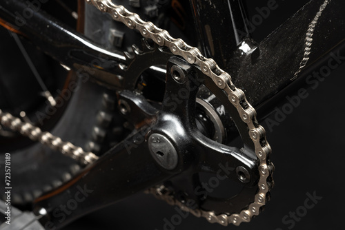 New bicycle chain part close up on black background