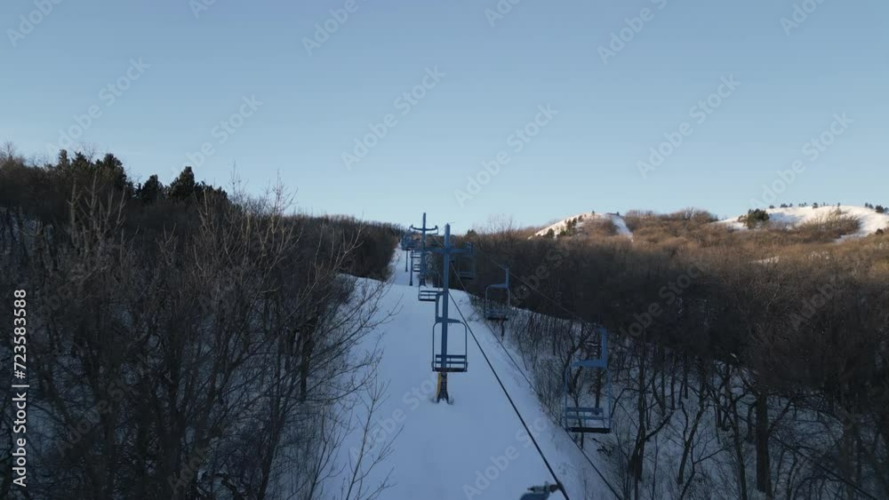 Aerial View Flying Over Chair Lift on Ski Hill at Huff Hills in Mandan, North Dakota, USA. 4K Drone Aerial View Flying Over Chair Lift on Ski Hill at Huff Hills in Mandan, North Dakota, USA. 4K Drone