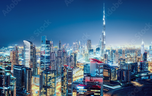 Fantastic nightime skyline of a big modern city. Downtown Dubai, United Arab Emirates. Colourful cityscape with skyscrapers.