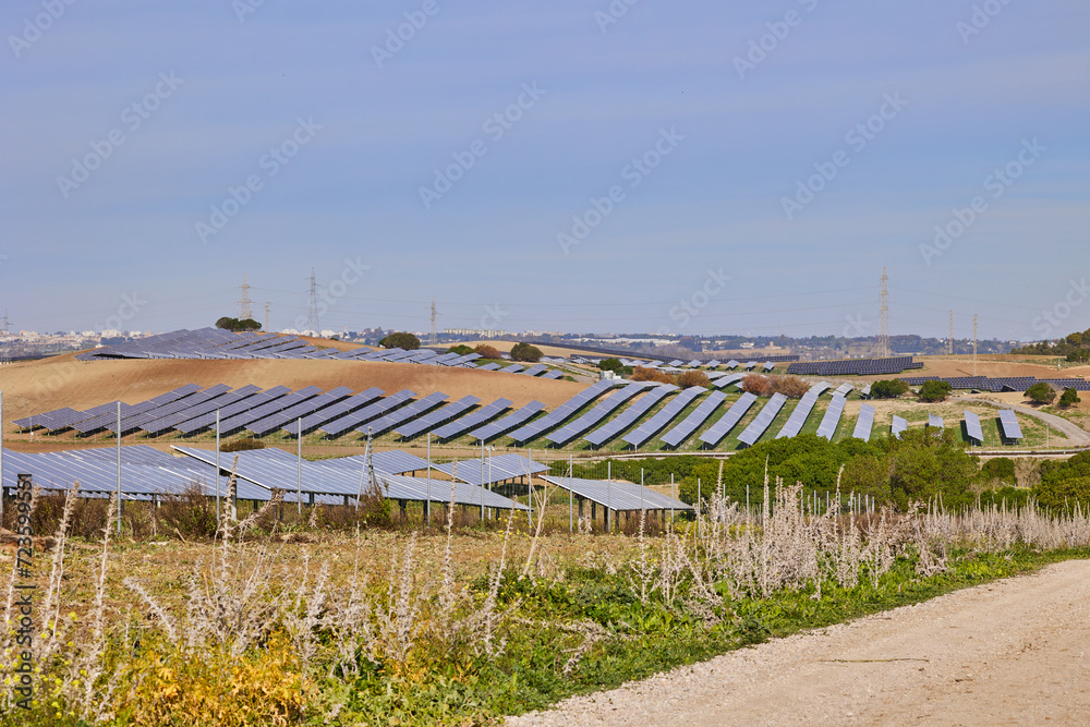 Electrical power plant with rows of solar panels for producing clean ecological electric energy. Renewable electricity with zero emission. Electrical power plant with rows of solar panels for producing clean ecological electric energy. Renewable electricity with zero emission.