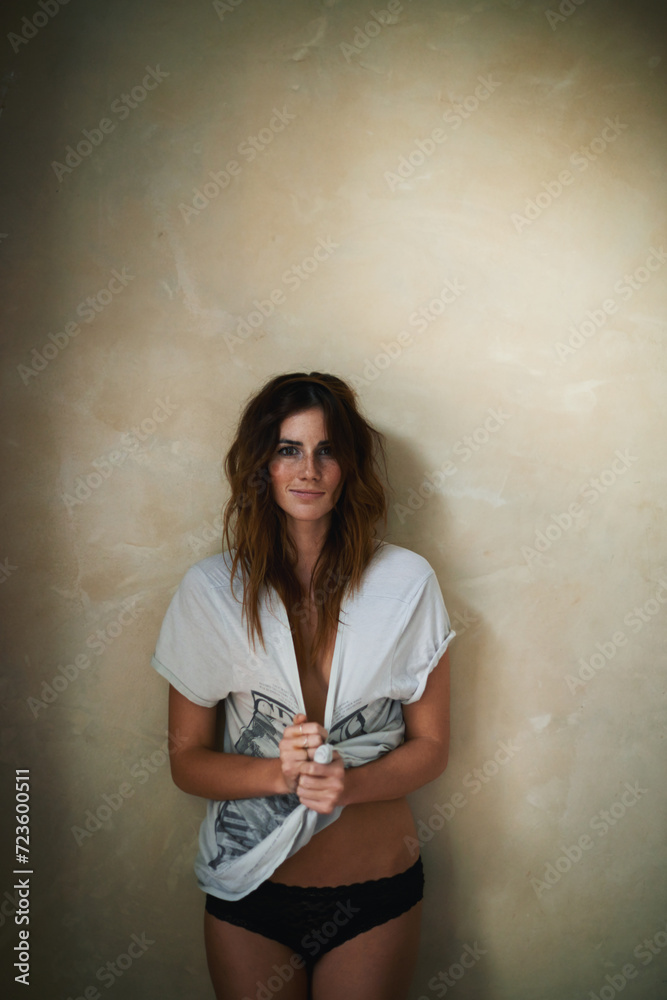 Fototapeta premium Happy woman, portrait and underwear in fashion on wall background for style or standing at home. Face of attractive young female person or brunette smile in stylish or casual clothing on mockup space