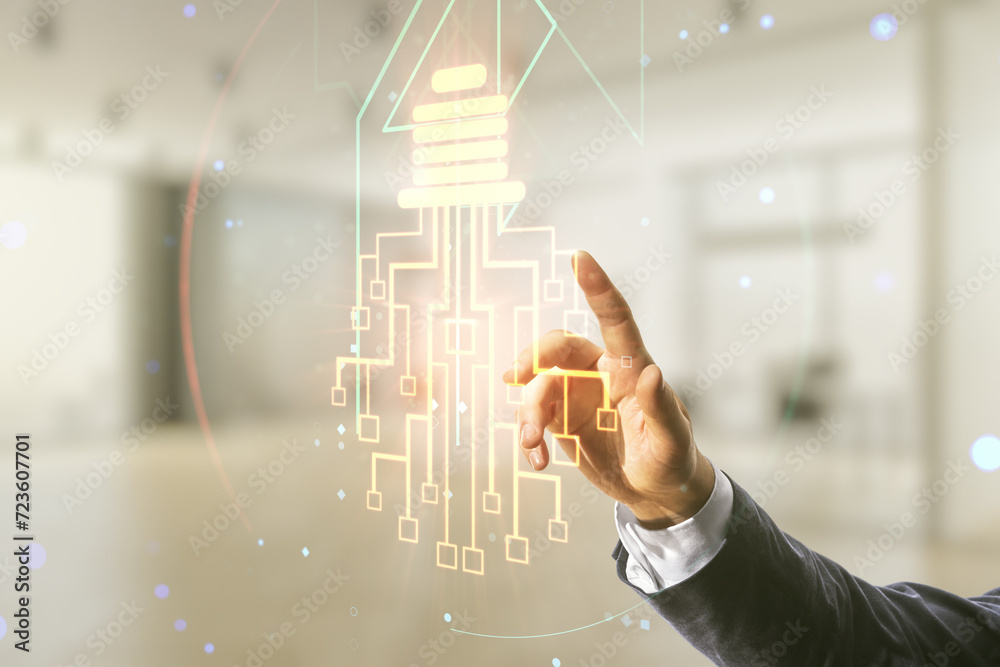 Male hand working with virtual creative light bulb with chip hologram on blurred office background, artificial Intelligence and neural networks concept. Multiexposure