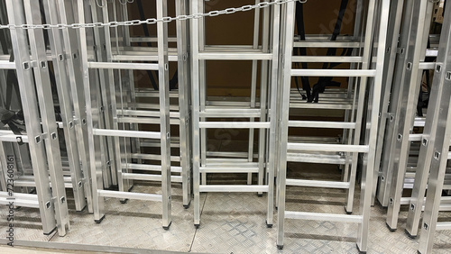 Aluminum stairs in the store, Stairs of ladder for construction in shop, New aluminum stepladders in tool store, nobody, Many new step ladder display on the tool store (shop).