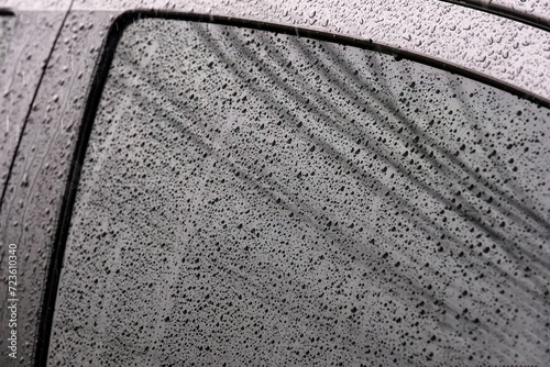 Water raindrop on car window glass in rainy day