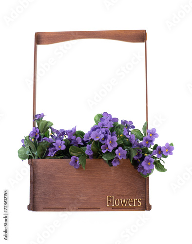artificial purple flowers in wooden box isolated on white background