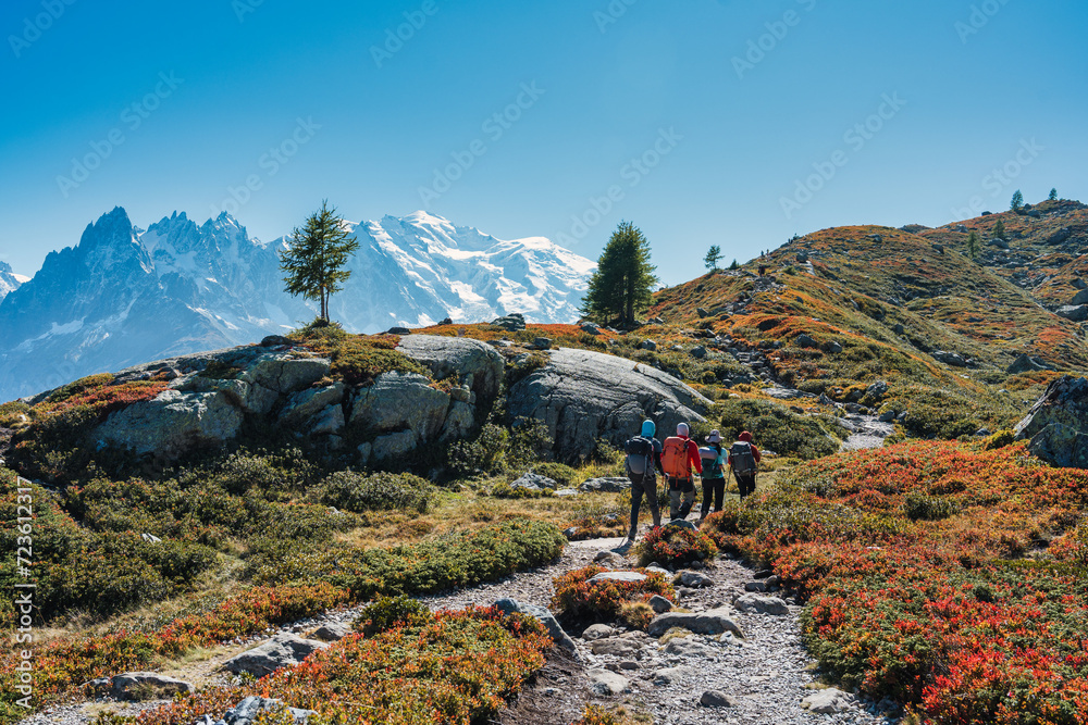 Φωτογραφία Group of hiker hiking on summit trail amidst the French alps on sunny day at Fra