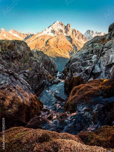 French alps mountain with stream flowing in rocky valley at Lac Blanc