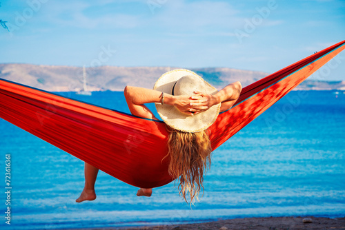 summer vacation concept, woman relaxing in bikini in hammock on tropical beach © M.studio
