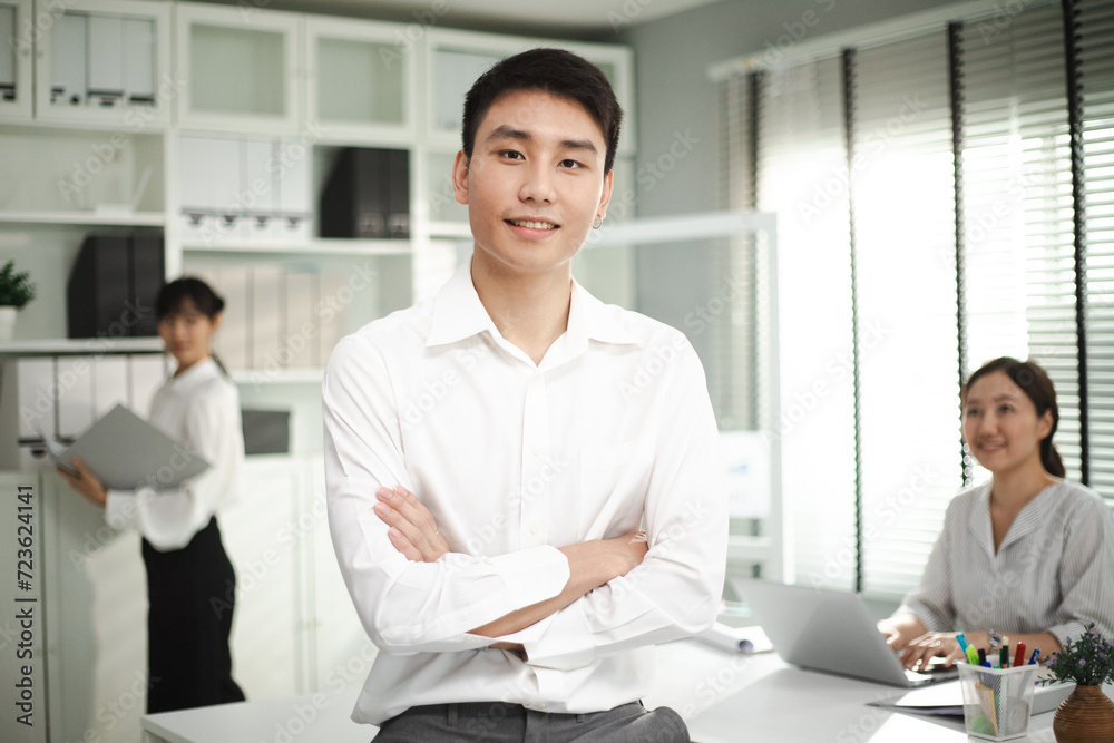 Portrait of happy handsome businessman wearing spectacles and looking at camera. Multiethnic satisfied man feeling confident in a creative office. Portrait of happy handsome businessman wearing spectacles and looking at camera. Multiethnic satisfied man feeling confident in a creative office.