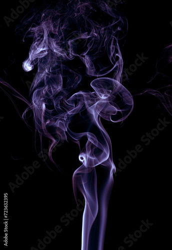 Purple smoke on dark background.