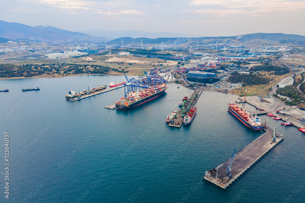 Aerial view of Industrial port with container terminal with loading and unloading cargo ships