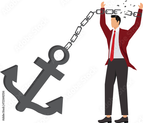 Businessman struggling to break free from shackles,