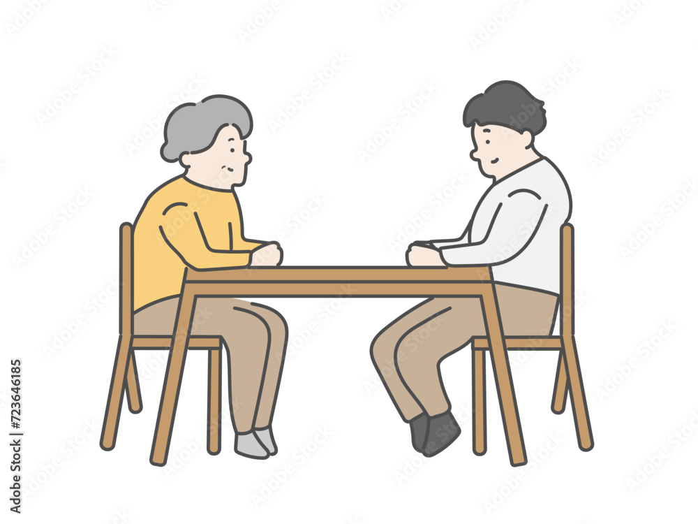 話し合いをする高齢女性と男性介護士