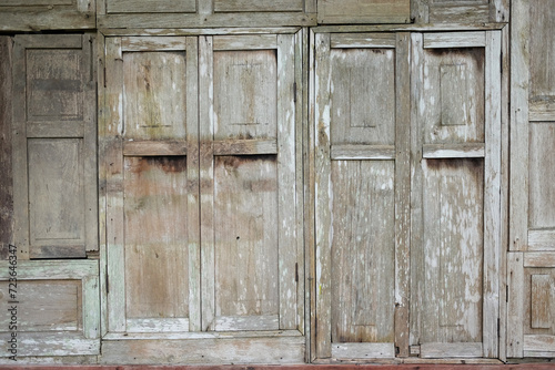 Rustic aged wooden window on building village