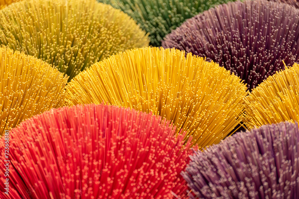 Colorful incense stick drying the sun , colorful background