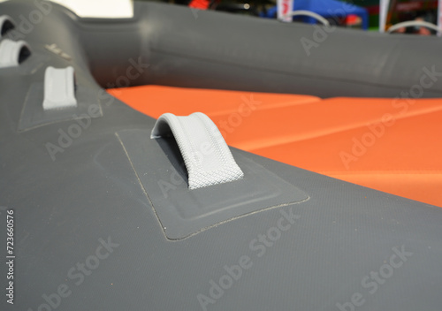 Close up on rigid inflatable boat handles. Inflatable boat grab handle rubber.