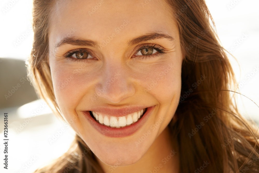 Portrait, smile and woman on beach at sunset for travel, tropical vacation or island holiday closeup. Face, summer and nature with happy young tourist outdoor on coast by sea or ocean in paradise