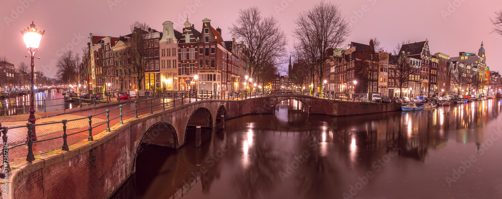 Panorama of Amsterdam canal Keizersgracht with typical dutch houses at night, Holland, Netherlands
