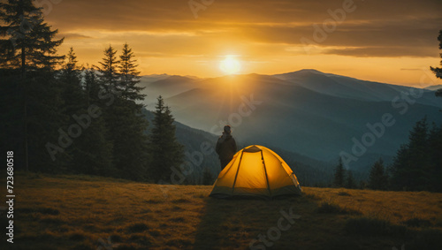 hiker camping in tent in the forest at sunset