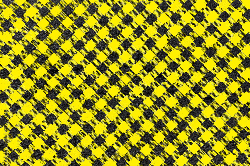 marquage en damier tissu Vichy jaune sur asphalte 
