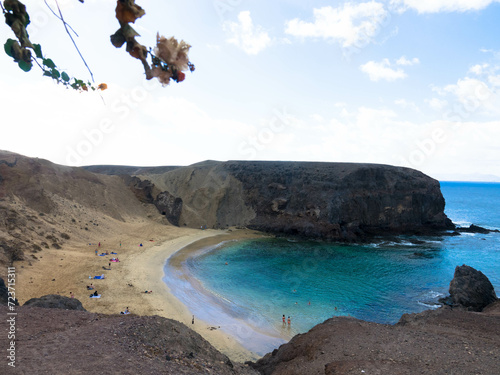 Panoramic view of the natural sandy beach of Papagayo on Lanzarote in a volcanic landscape in Los Ajaches National Park. Playa Blanca, Lanzarote, Spain photo