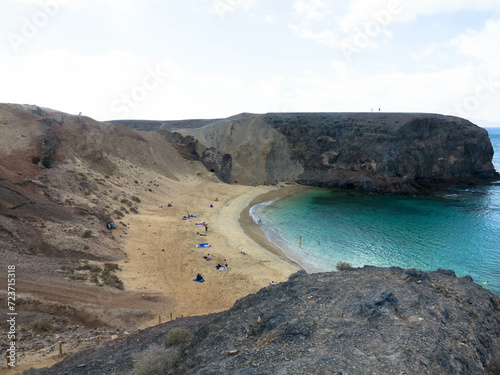 Panoramic view of the natural sandy beach of Papagayo on Lanzarote in a volcanic landscape in Los Ajaches National Park. Playa Blanca, Lanzarote, Spain