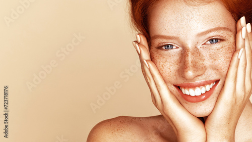 Skin care. Pigmentation. Beauty portrait of a girl with a freckles. Beautiful model with beautiful natural ginger red hair photo