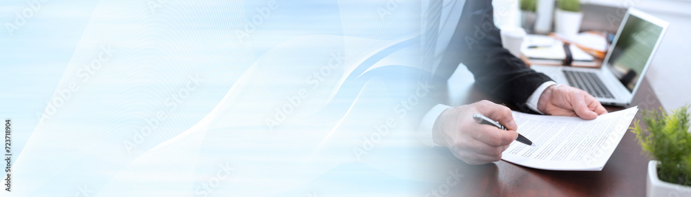 Businessman reading and checking document (lorem ipsum text used); panoramic banner Businessman reading and checking document (lorem ipsum text used); panoramic banner
