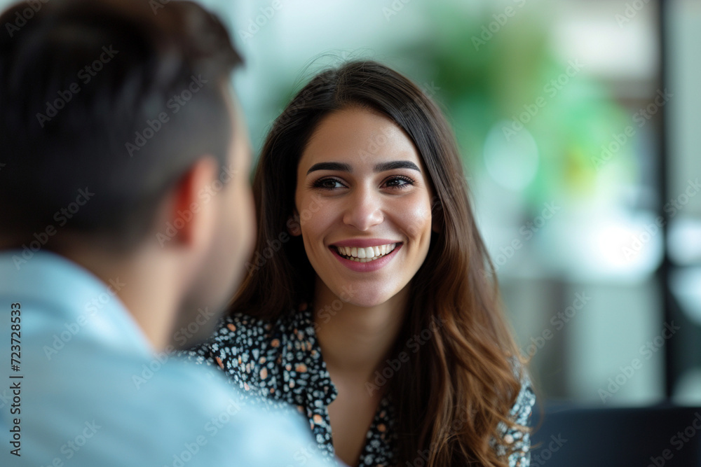 Fototapeta premium Happy businesswoman interviewing a well-prepared job candidate in a cozy office environment. The job interview process - from expectation to excitement, captured in high-definition