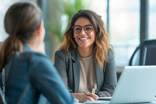 Happy businesswoman interviewing a well-prepared job candidate in a cozy office environment. The job interview process - from expectation to excitement, captured in high-definition