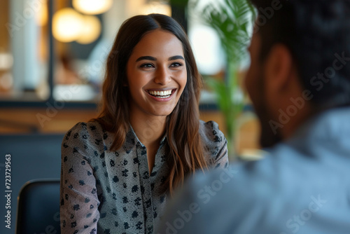 Happy businesswoman interviewing a well-prepared job candidate in a cozy office environment. The job interview process - from expectation to excitement, captured in high-definition
