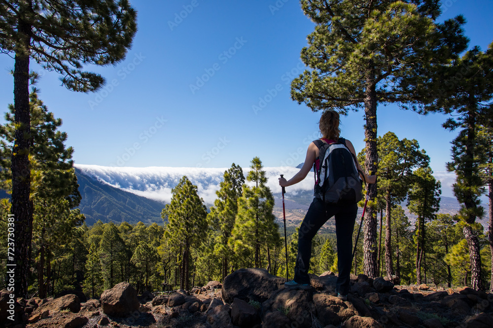 Young woman summit to Bejenado Peak in Caldera de Taburiente, La Palma, Spain Young woman summit to Bejenado Peak in Caldera de Taburiente, La Palma, Spain