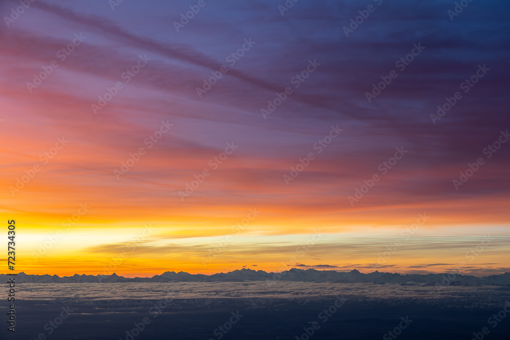 Colourful morning sky with Cirrus clouds above Swiss Alps