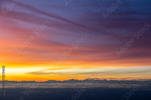 Colourful morning sky with Cirrus clouds above Swiss Alps © Thomas