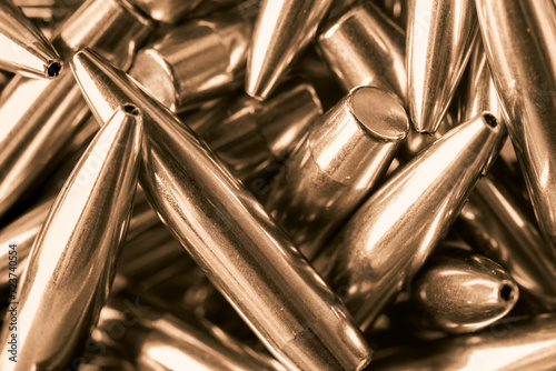 Full-frame background photo of golden metal bullets © Ekaterina Myshenko
