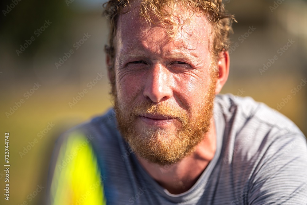 blonde athlete training in the hot sun in summer. playing tennis close up portrait blonde athlete training in the hot sun in summer. playing tennis close up portrait
