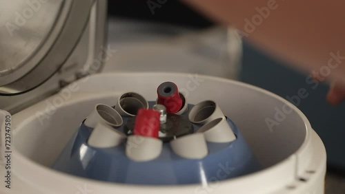 Close-up shot of blood samples spinning in centrifuge during fractionation process