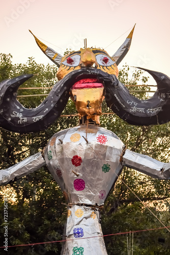 Ravnans being ignited during Dussera festival at ramleela ground in Delhi, India, Big statue of Ravana to get fire during the Fair of Dussera to celebrate the victory of truth by Lord Rama photo