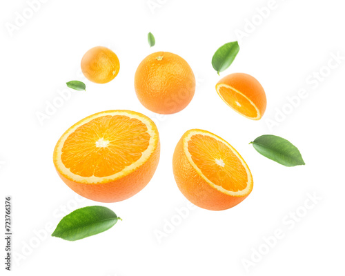 Orange with cut in half and leaves levitate isolated on white background.
